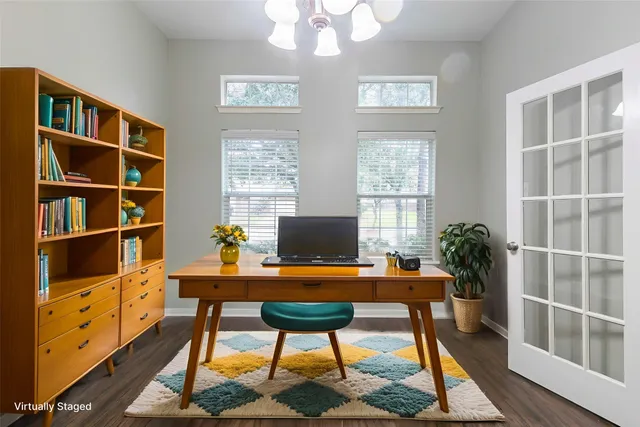 a workspace with furniture and a bookshelf