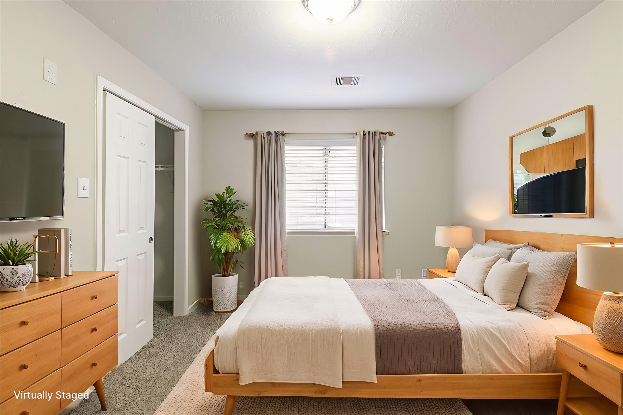 5601 Savannah Woods Lane Rosharon, TX 77583 - Photo 6 of 43 a bedroom with a bed and a flat tv screen on dresser