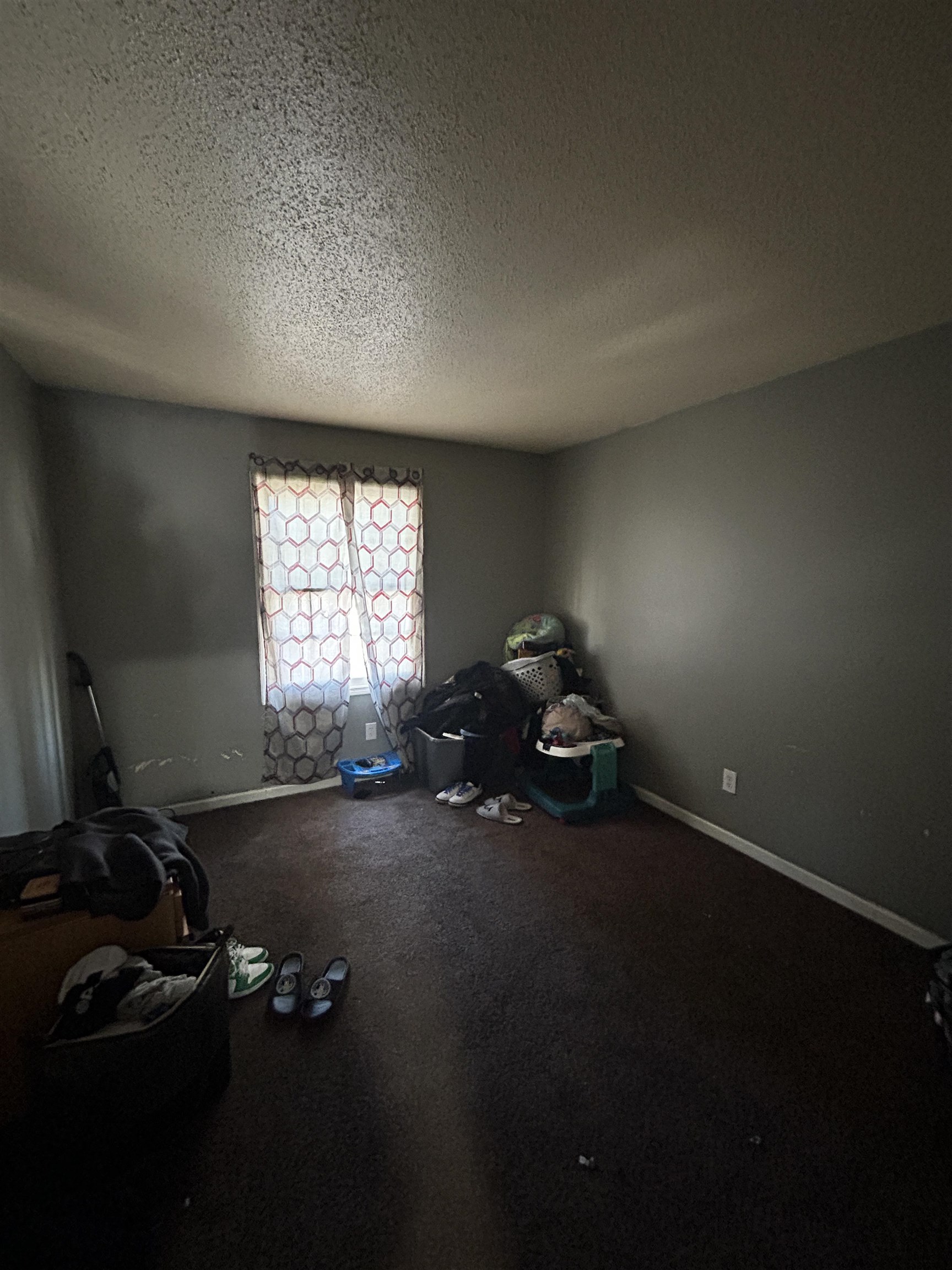 5237 Flowering Peach Drive Memphis, TN 38115 - Photo 12 of 15 Spare room featuring baseboards and a textured ceiling