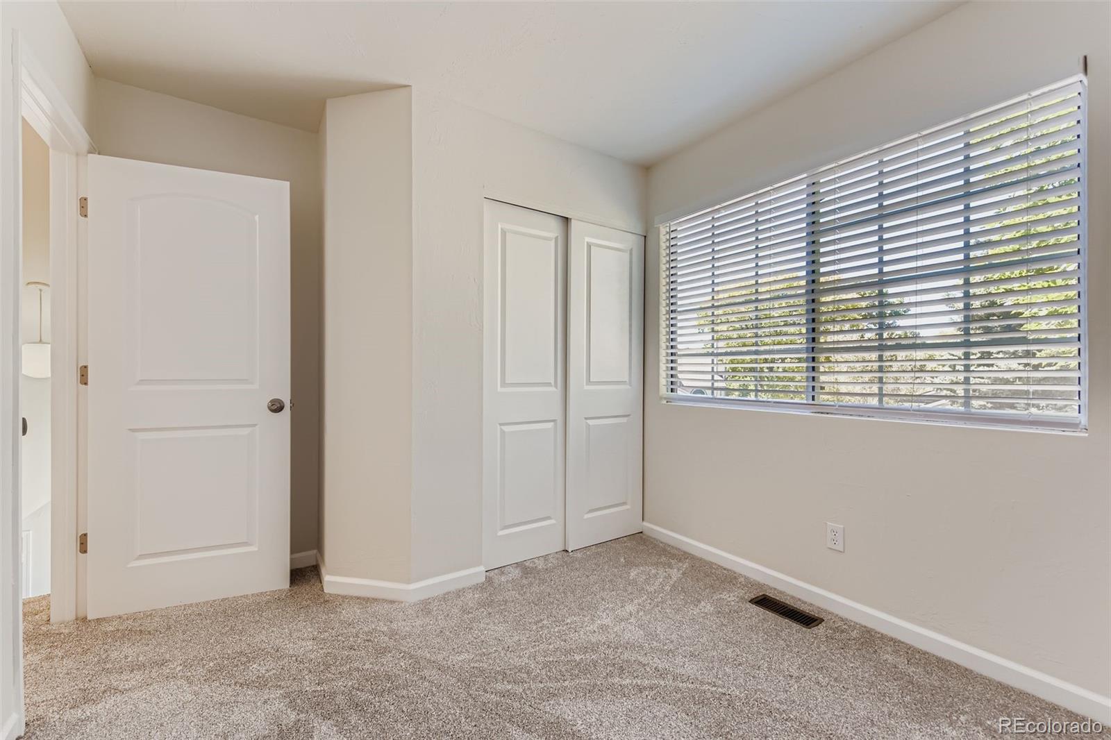 9510 Joyce Lane Highlands Ranch, CO 80126 - Photo 13 of 23 an empty room with windows