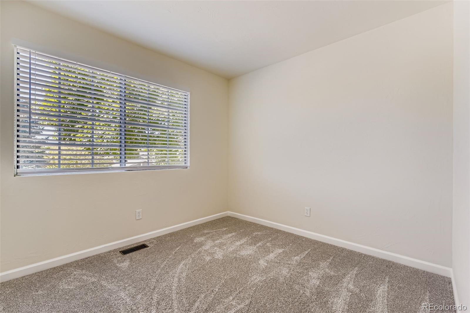 9510 Joyce Lane Highlands Ranch, CO 80126 - Photo 14 of 23 an empty room with a window