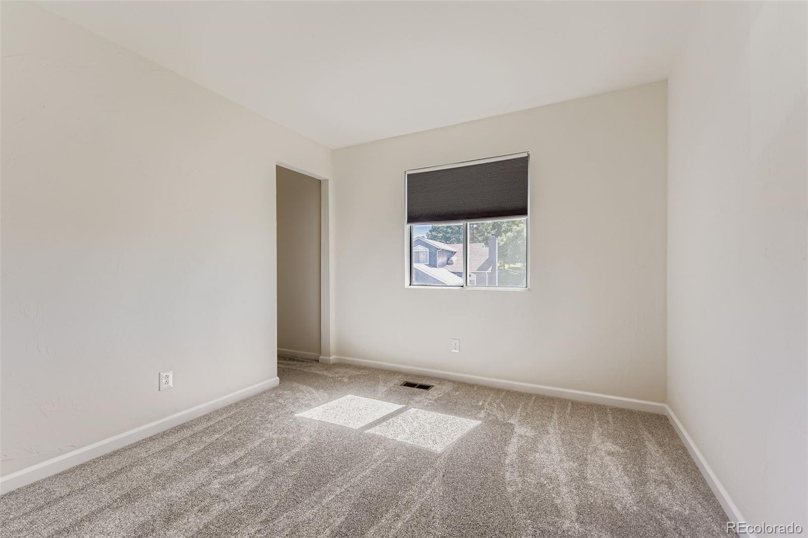 9510 Joyce Lane Highlands Ranch, CO 80126 - Photo 15 of 23 an empty room with windows