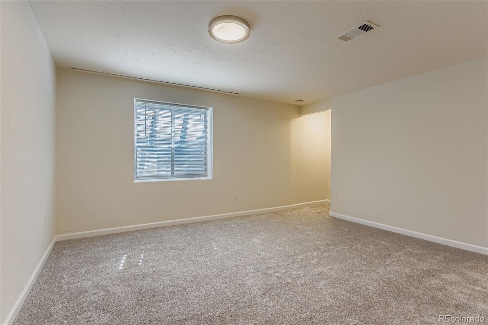 9510 Joyce Lane Highlands Ranch, CO 80126 - Photo 17 of 23 an empty room with windows