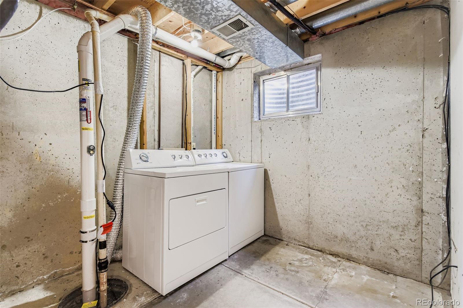 9510 Joyce Lane Highlands Ranch, CO 80126 - Photo 20 of 23 a utility room with dryer and washer