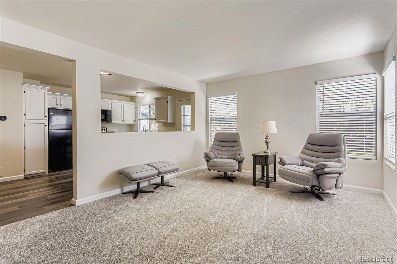 9510 Joyce Lane Highlands Ranch, CO 80126 - Photo 4 of 23 a living room with furniture and a window