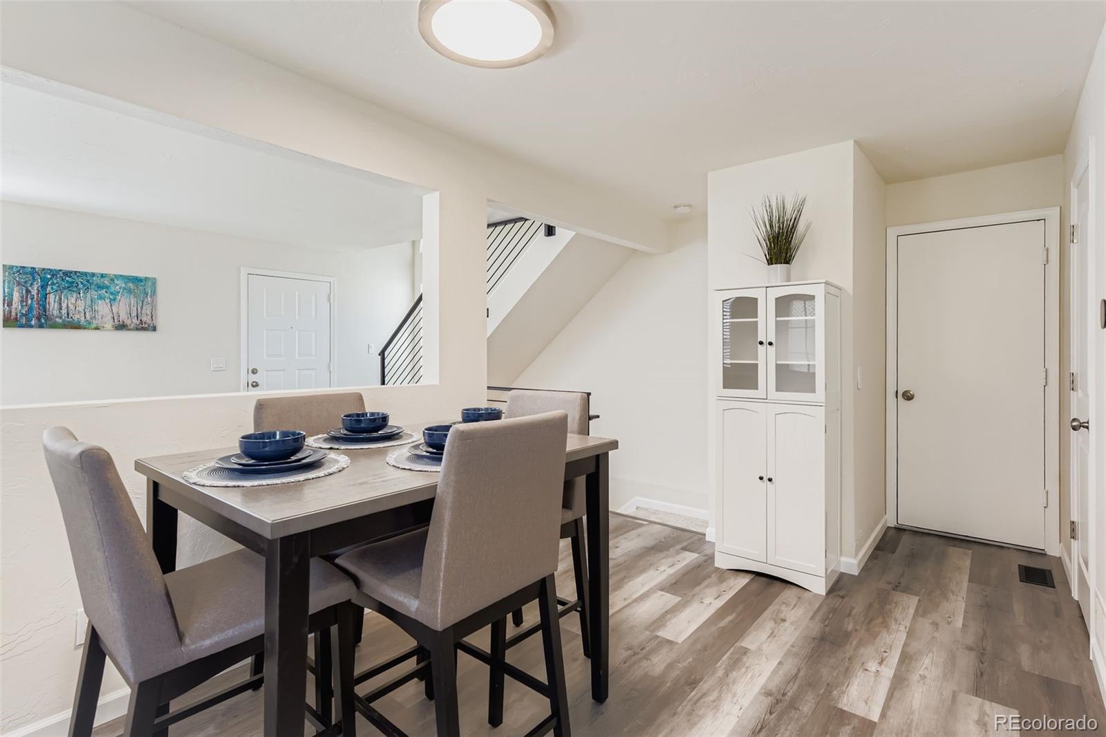 9510 Joyce Lane Highlands Ranch, CO 80126 - Photo 5 of 23 a view of a dining room with furniture and wooden floor