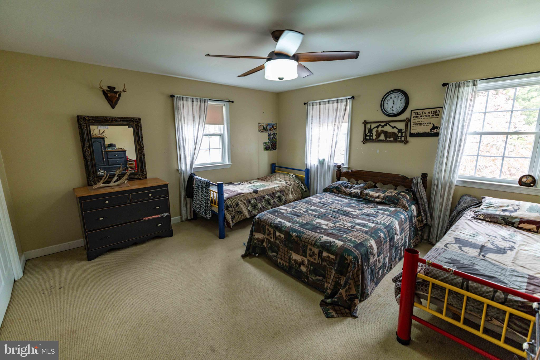 339 Churchtown Road Narvon, PA 17555 - Photo 131 of 150 a bedroom with a bed and a chandelier