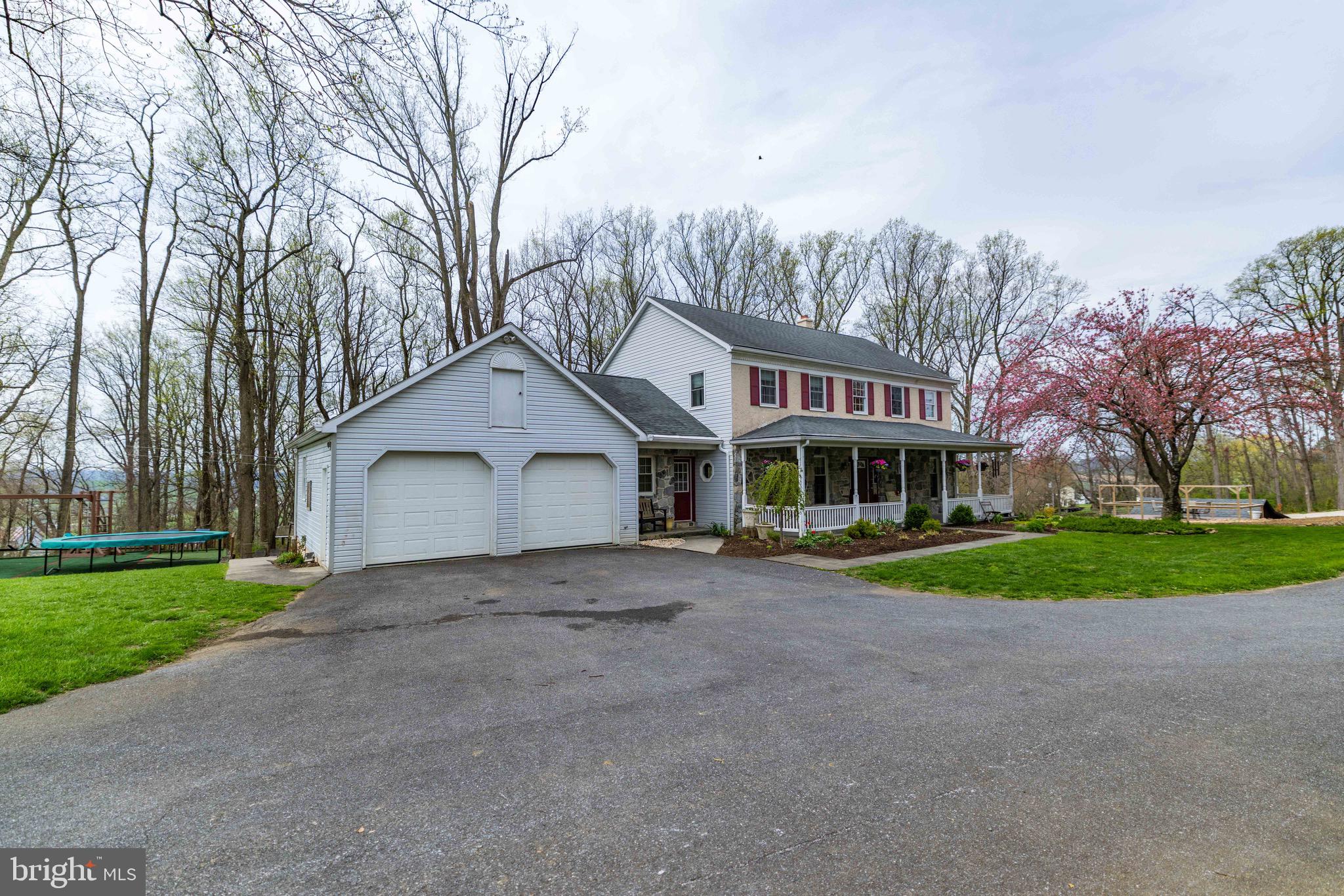 339 Churchtown Road Narvon, PA 17555 - Photo 77 of 150 a front view of a house with a yard and garage