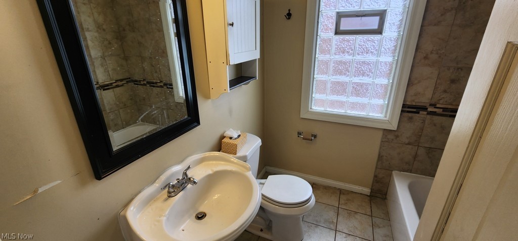 3599 Grosvenor Road Cleveland, OH 44118 - Photo 16 of 25 Bathroom featuring toilet and light tile patterned floors