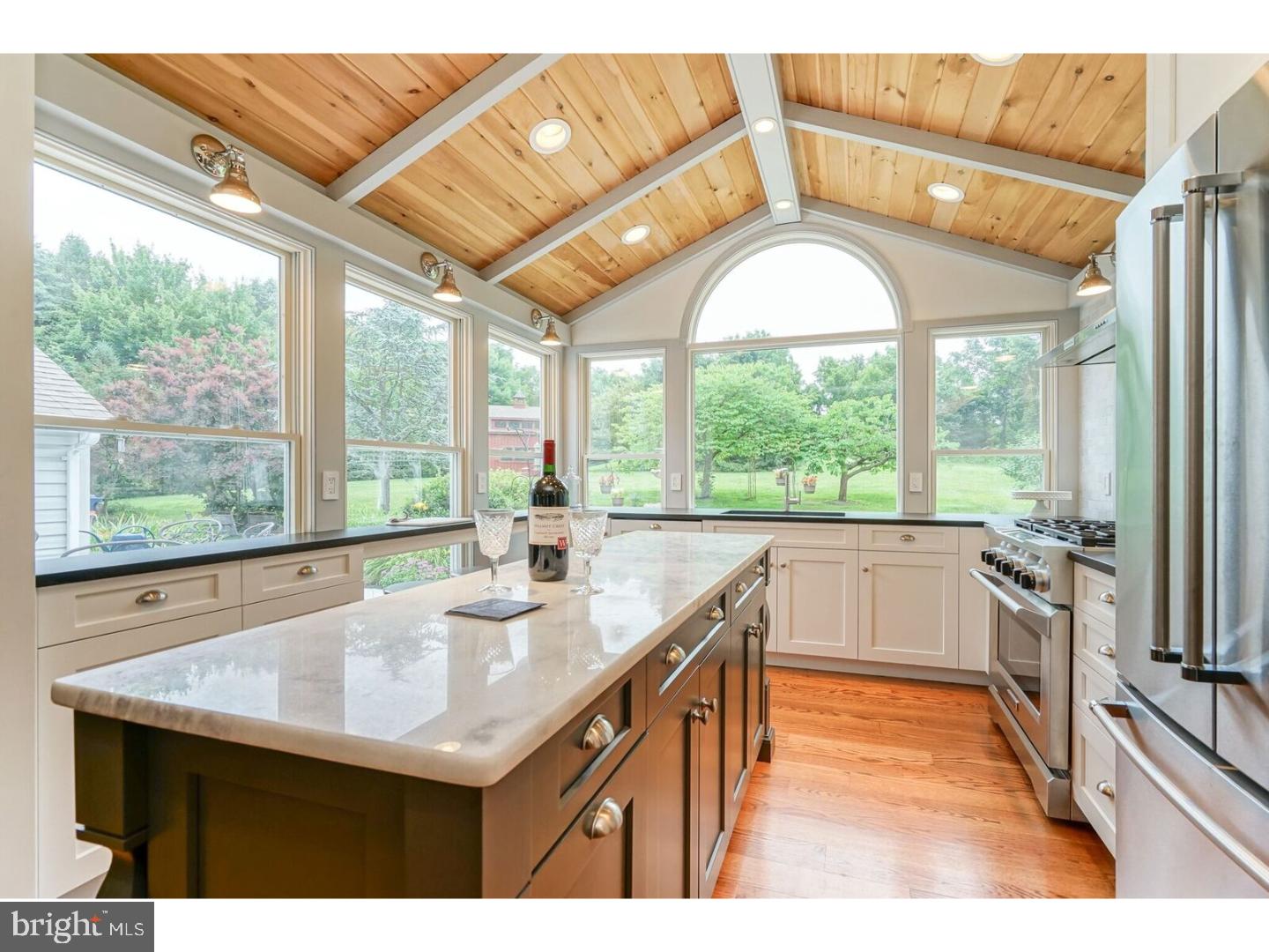 a kitchen with a sink and a large window