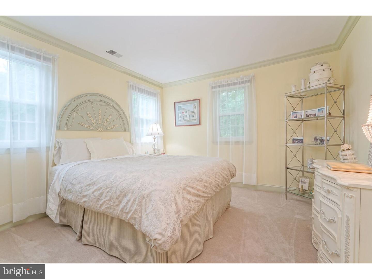 85 Brownsburg Road Newtown, PA 18940 - Photo 15 of 25 a bedroom with a bed and a painting on the wall