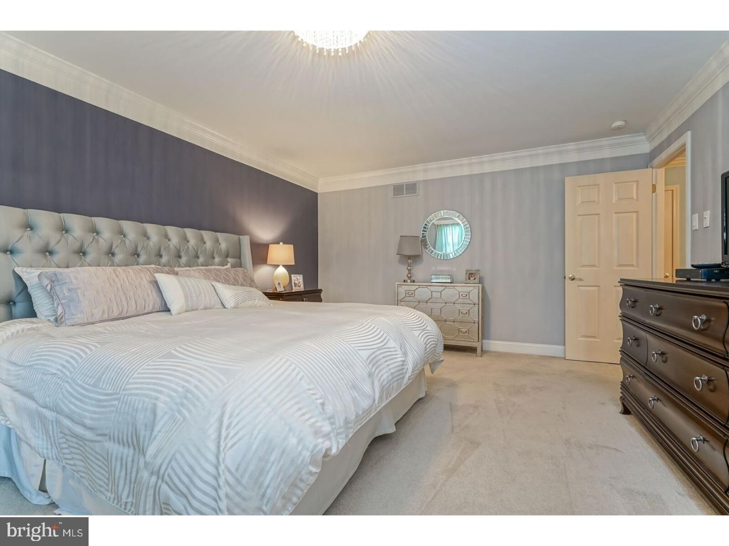 85 Brownsburg Road Newtown, PA 18940 - Photo 16 of 25 a bedroom with a bed and lamp