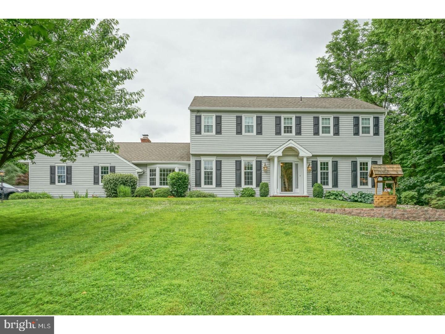 85 Brownsburg Road Newtown, PA 18940 - Photo 21 of 25 a front view of a house with a garden