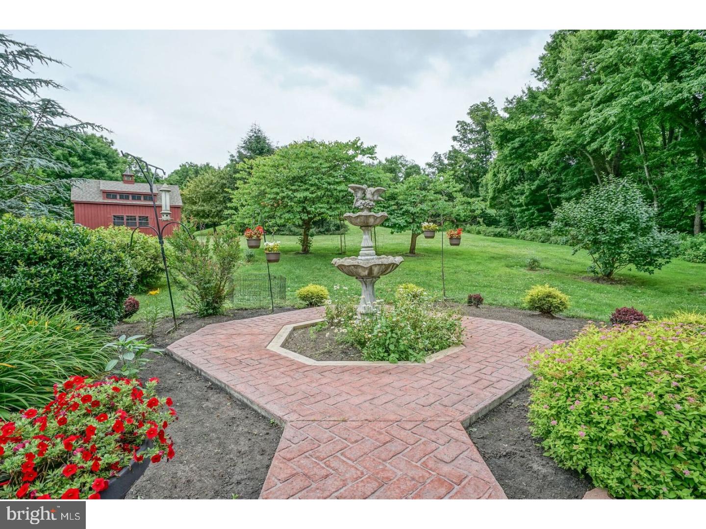85 Brownsburg Road Newtown, PA 18940 - Photo 23 of 25 a view of a garden with a fountain