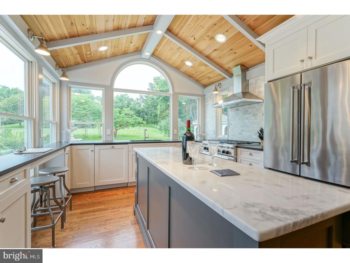 85 Brownsburg Road Newtown, PA 18940 - Photo 4 of 25 a bathroom with a sink a mirror and a large window