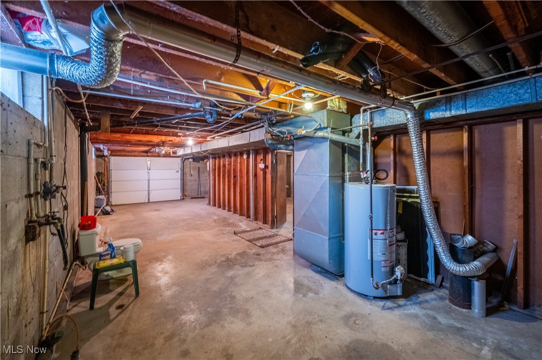 1329 Oak Grove Road Waverly, WV 26184 - Photo 19 of 29 Below grade area featuring water heater and a garage
