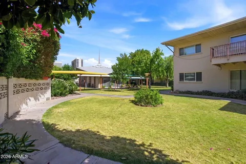 a swimming pool with outdoor seating and yard