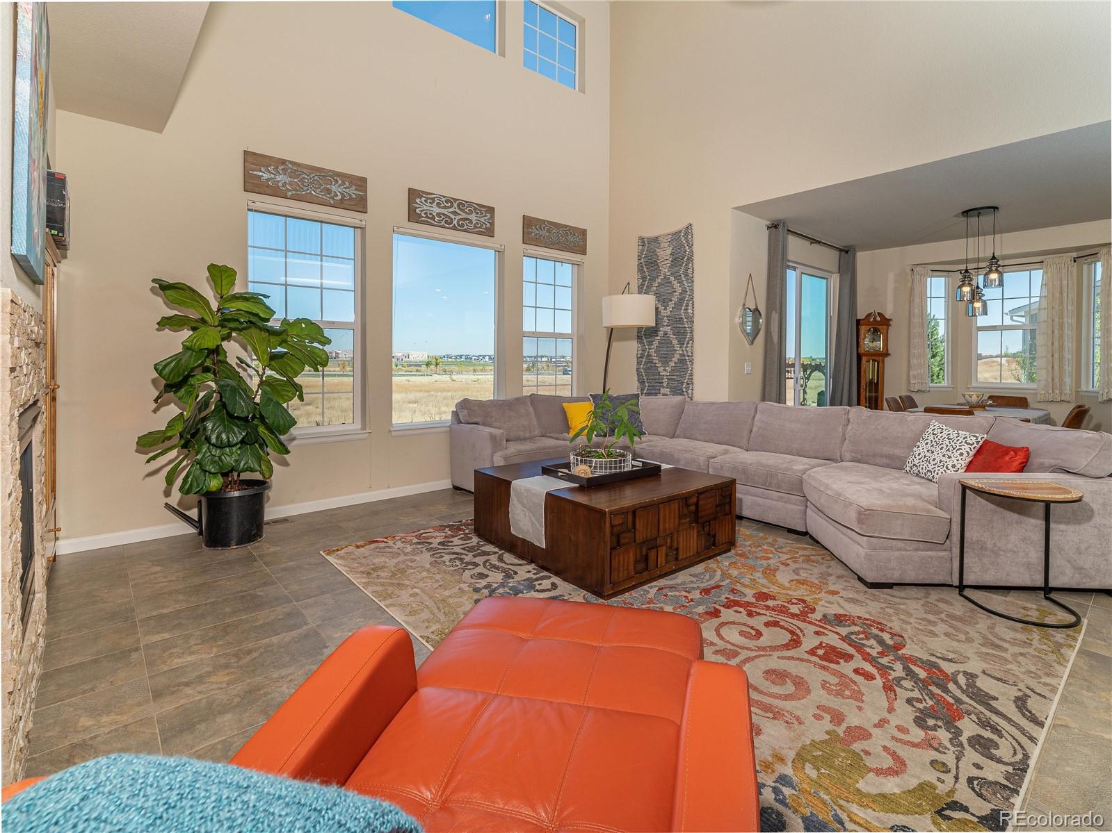 5025 Eagan Circle Longmont, CO 80503 - Photo 12 of 40 a living room with furniture and large windows