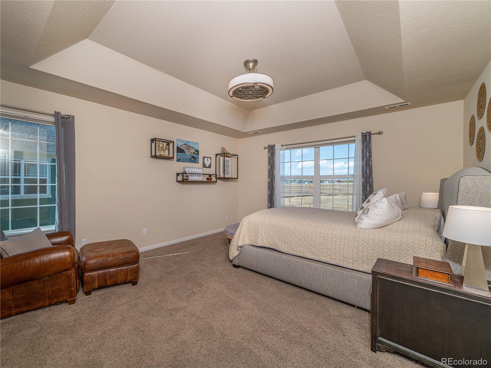 5025 Eagan Circle Longmont, CO 80503 - Photo 18 of 40 a bedroom with a bed and window
