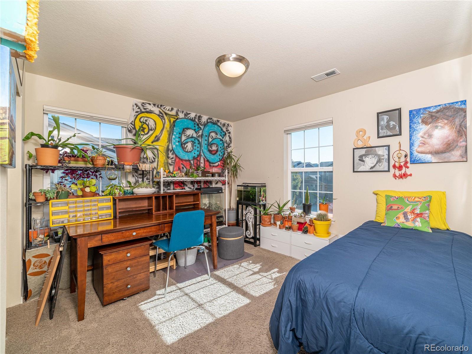 5025 Eagan Circle Longmont, CO 80503 - Photo 27 of 40 a bed room with a bed and a couch