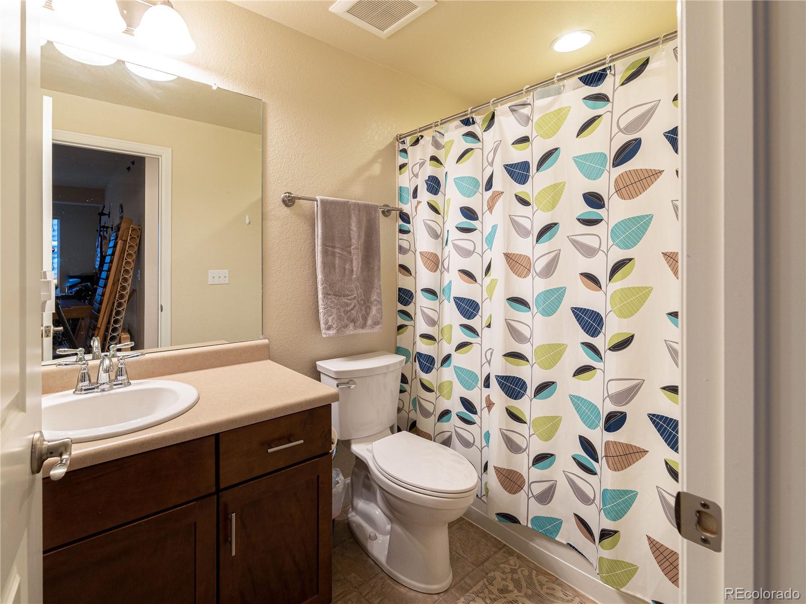 5025 Eagan Circle Longmont, CO 80503 - Photo 34 of 40 a bathroom with a sink and a mirror