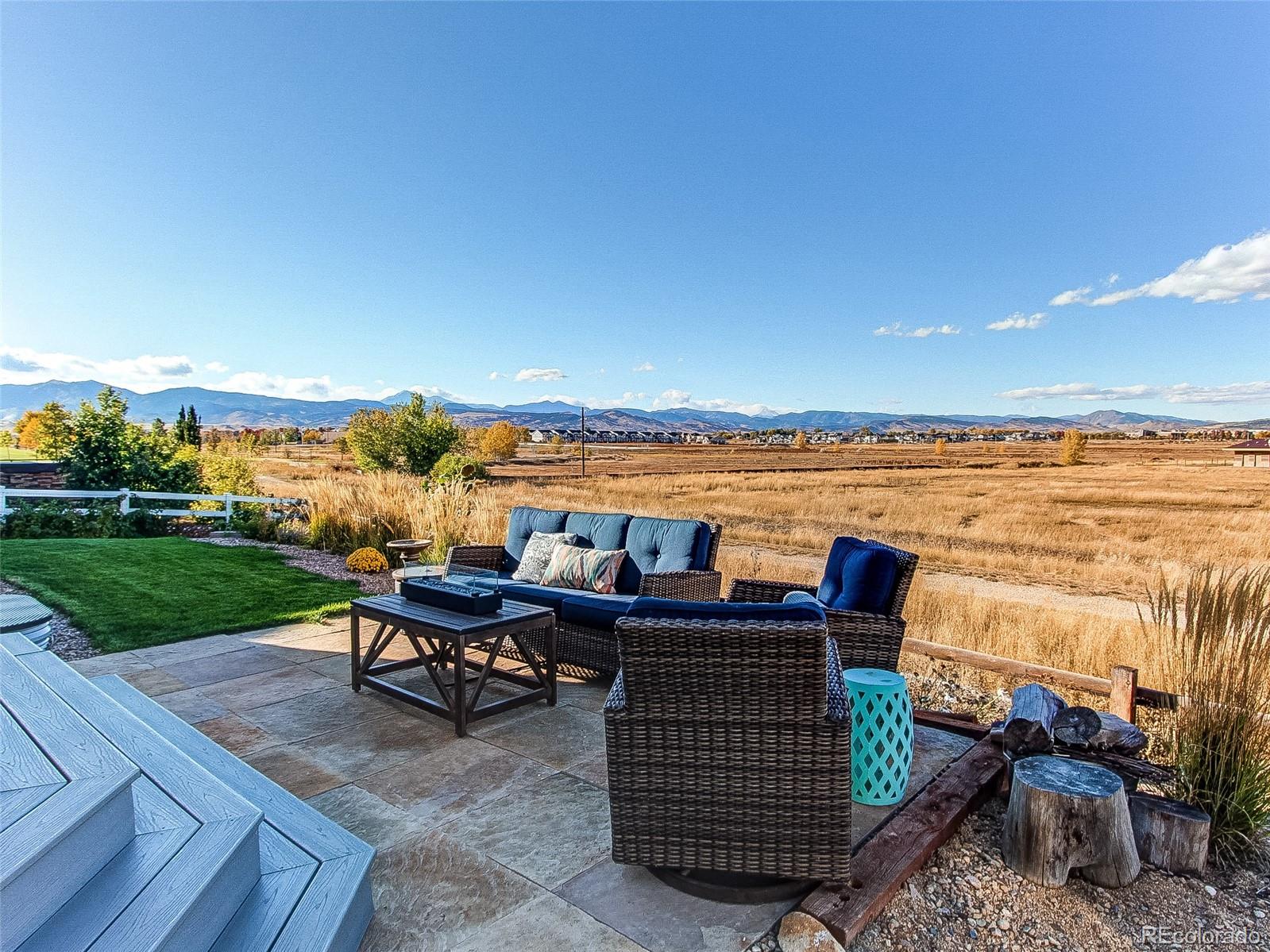 5025 Eagan Circle Longmont, CO 80503 - Photo 35 of 40 a patio with water view and a ocean view