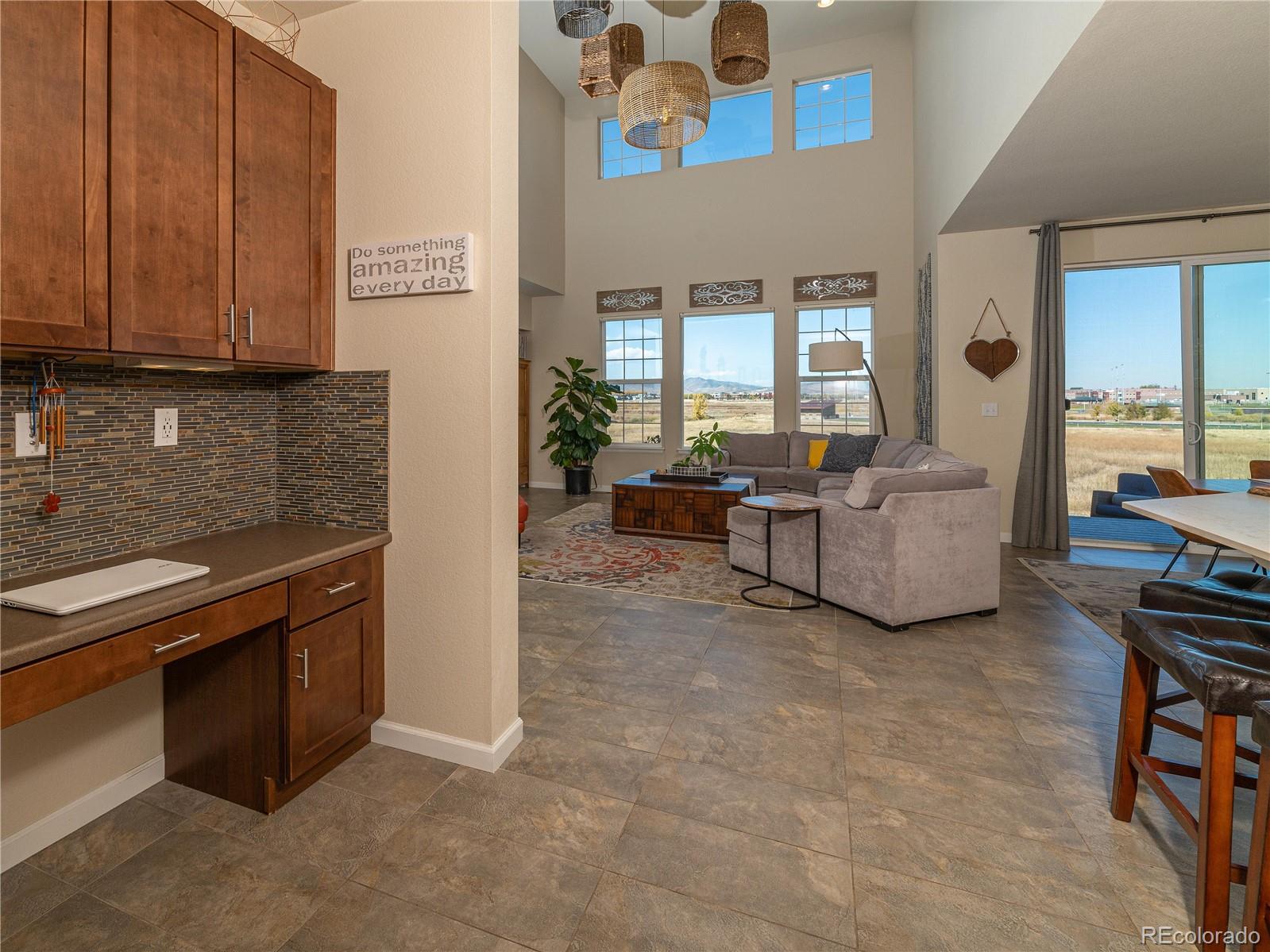 5025 Eagan Circle Longmont, CO 80503 - Photo 9 of 40 a living room with fireplace furniture and a window