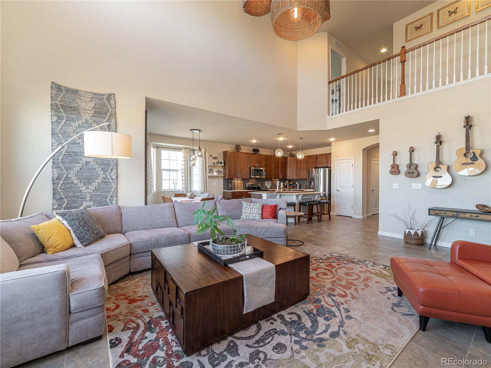 5025 Eagan Circle Longmont, CO 80503 - Photo 10 of 40 a living room with furniture and kitchen view