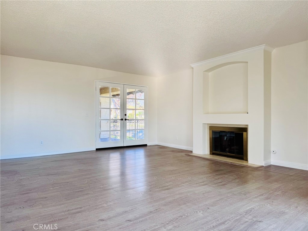 10983 Boulder Canyon Road Rancho Cucamonga, CA 91737 - Photo 8 of 41 Family Room with Gas Fireplace and French Doors Leading to Side Patio