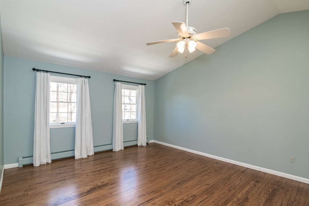 16 Shattuck Road Hadley, MA 01035 - Photo 29 of 42 an empty room with wooden floor fan and windows