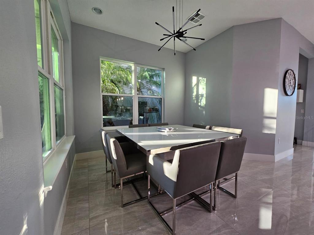 8552 Powder Ridge Trail Windermere, FL 34786 - Photo 11 of 30 a view of a dining room with furniture window and outside view