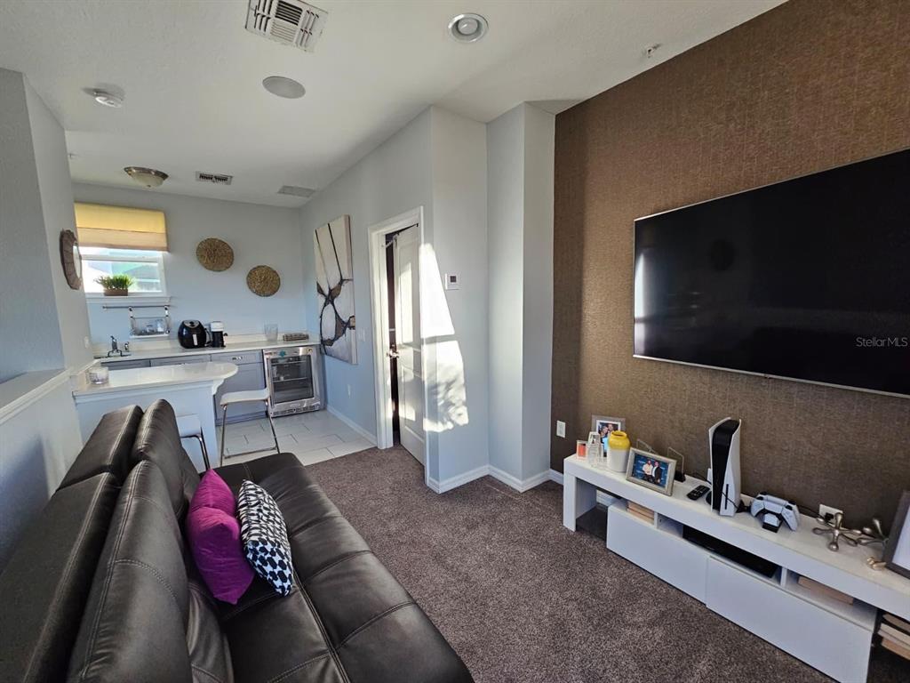 8552 Powder Ridge Trail Windermere, FL 34786 - Photo 17 of 30 a living room with furniture and a flat screen tv