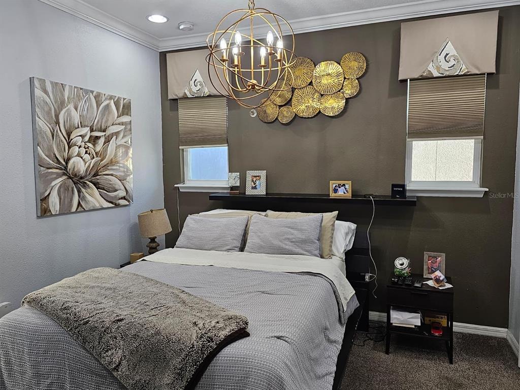 8552 Powder Ridge Trail Windermere, FL 34786 - Photo 20 of 30 a bedroom with a bed and wooden floor