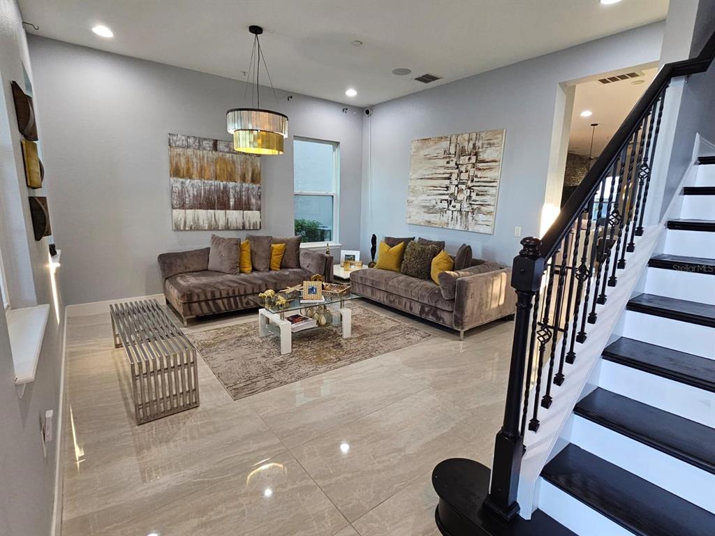 8552 Powder Ridge Trail Windermere, FL 34786 - Photo 8 of 30 a living room with furniture fireplace and rug