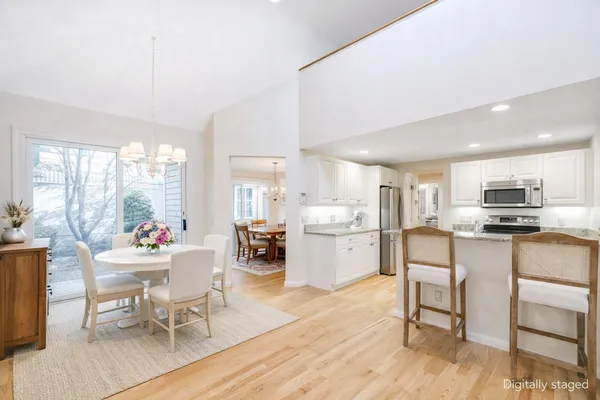 a dining room with furniture and window