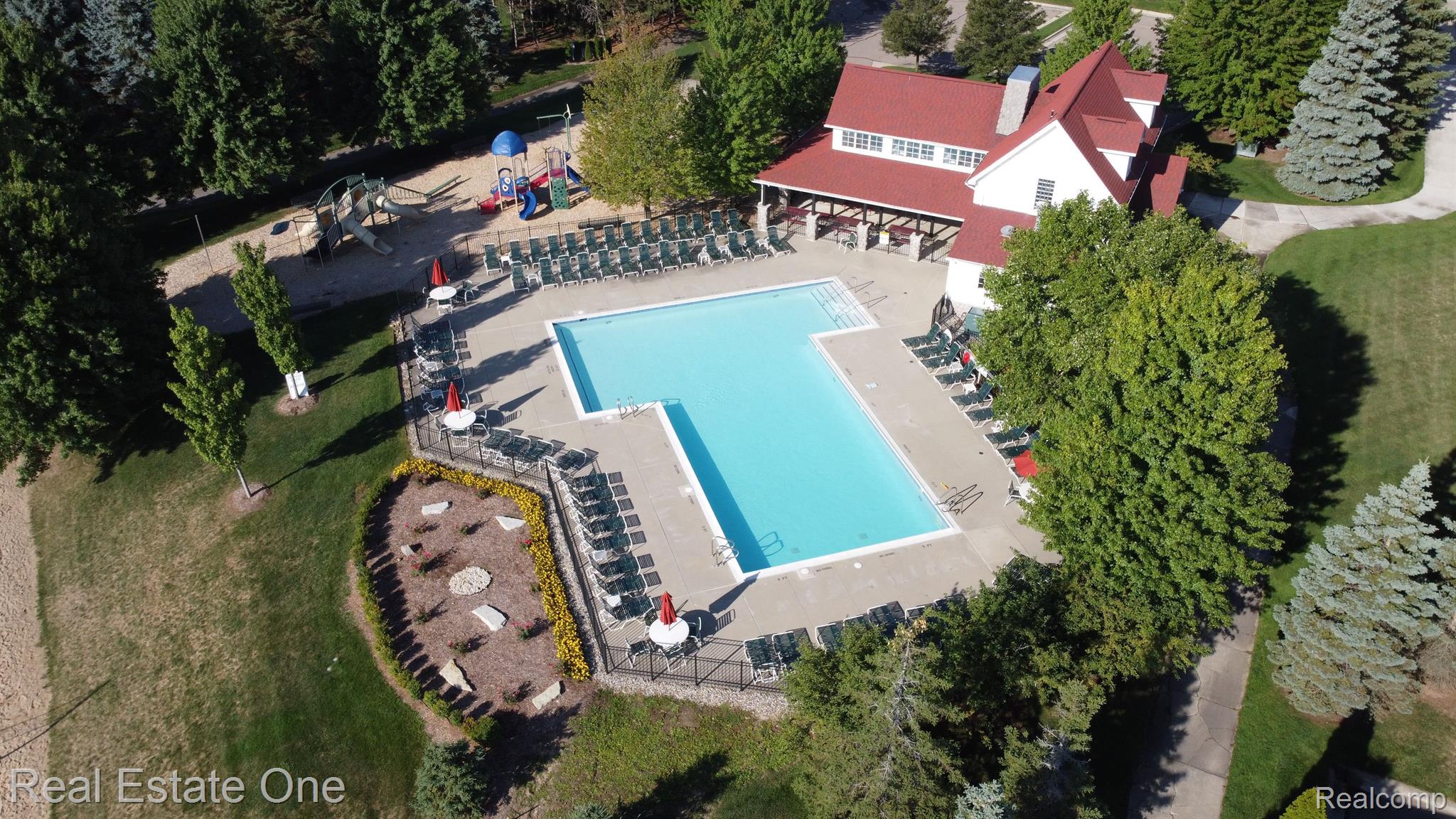726 Loggers Circle Rochester, MI 48307 - Photo 52 of 64 Drone Shot of Pool and Playground