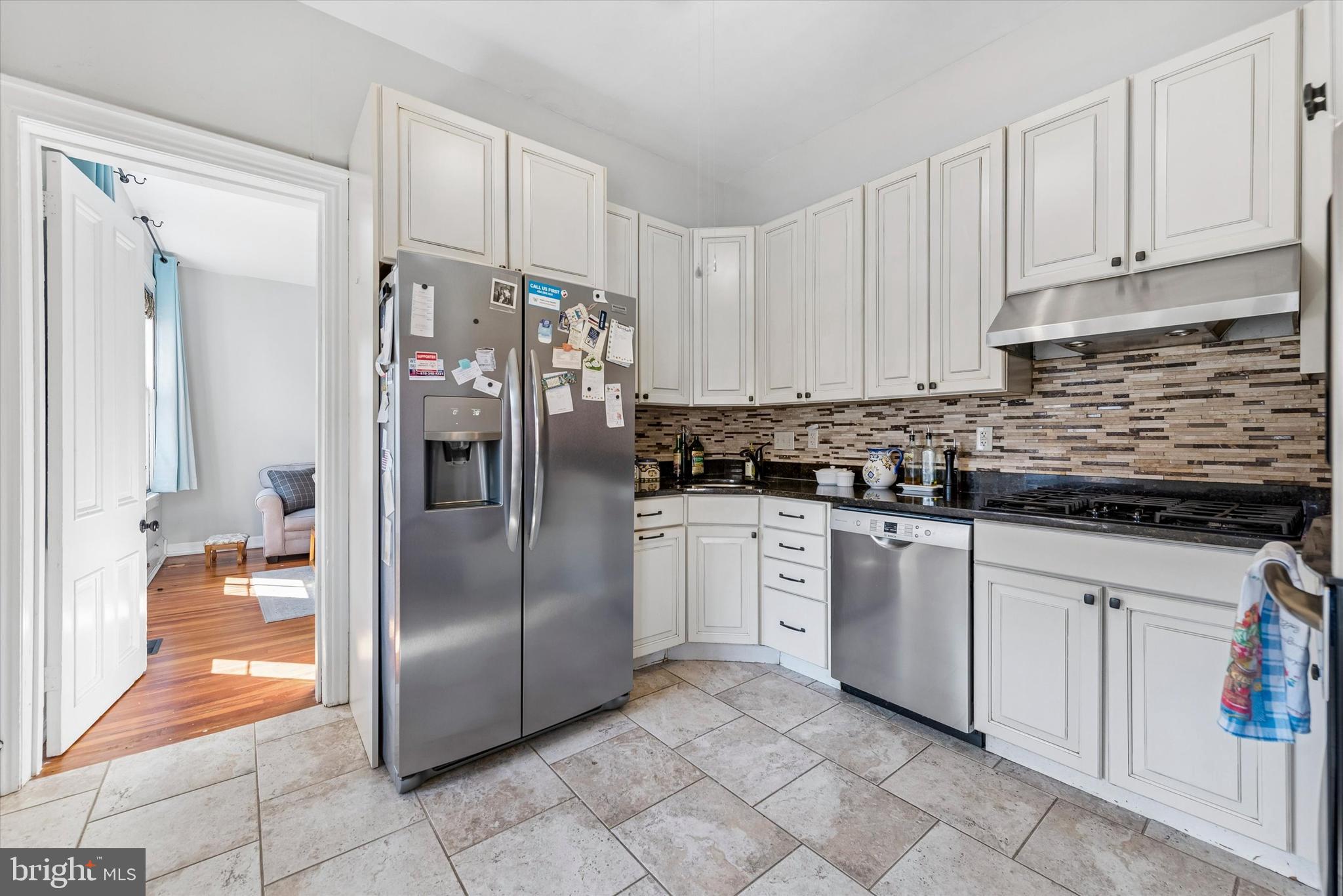 201 West Barnard Street, Unit 2 West Chester, PA 19382 - Photo 4 of 19 a kitchen with stainless steel appliances granite countertop a refrigerator and a sink
