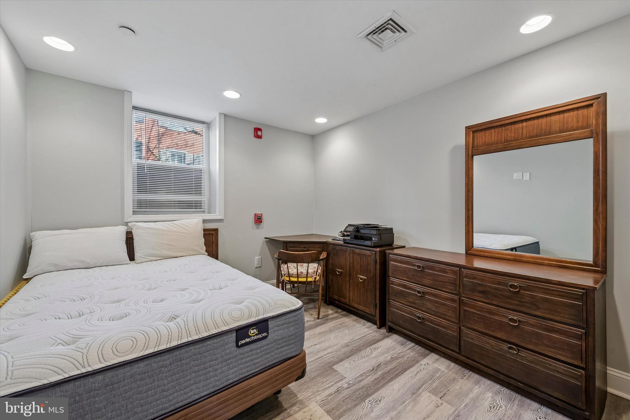 201 West Barnard Street, Unit 2 West Chester, PA 19382 - Photo 9 of 19 a bedroom with a bed and a dresser