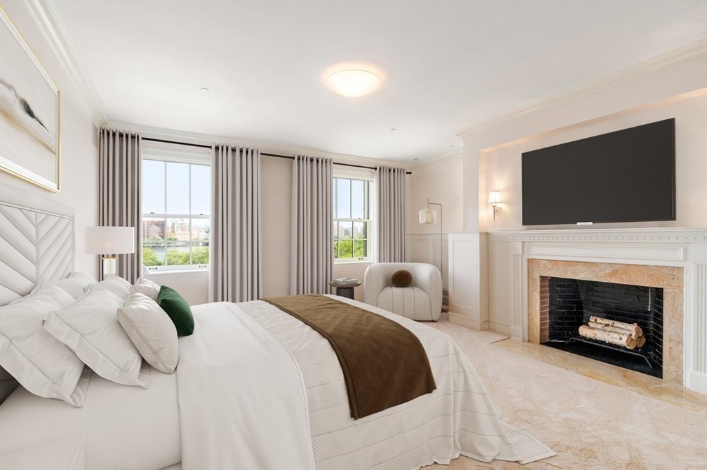 150 Beacon Street, Unit PH Boston, MA 02116 - Photo 18 of 24 a bedroom with a bed and a flat screen tv