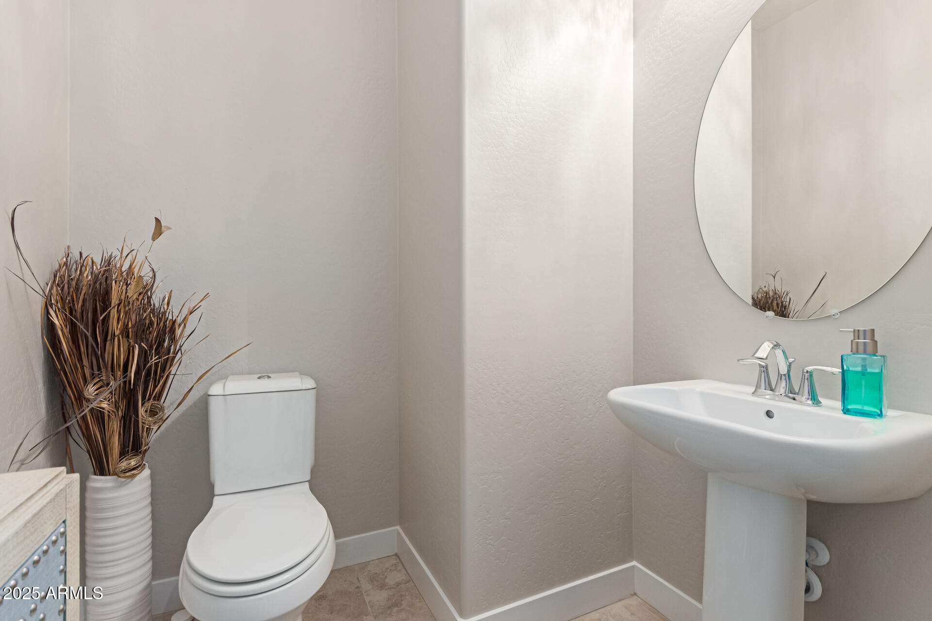 41737 West Cribbage Road Maricopa, AZ 85138 - Photo 26 of 35 a white toilet sitting next to a bathroom sink