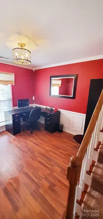 a backyard of a house with wooden floor