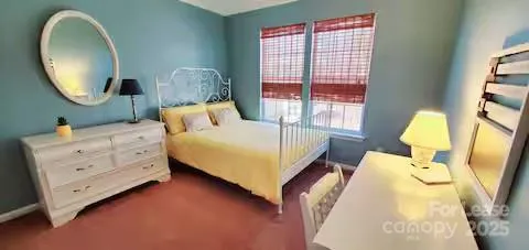 a bed room with a bed and a mirror