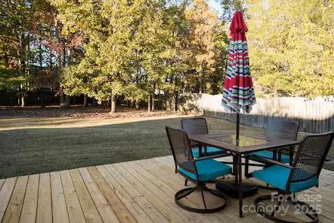 a view of a backyard with a sitting area and furniture