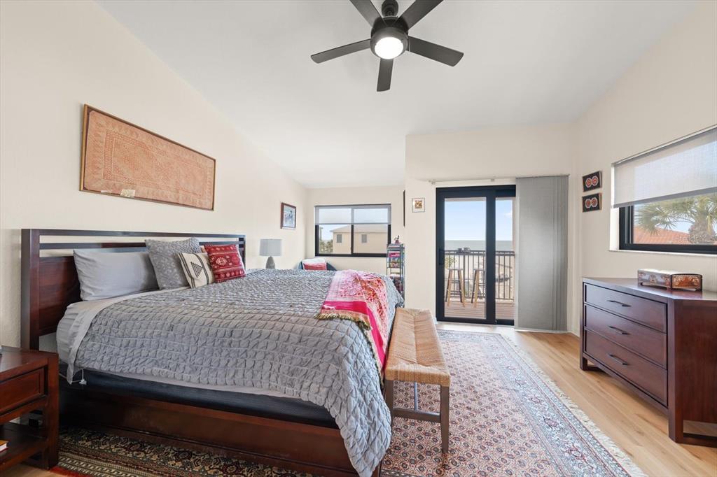 1206 Gulf Boulevard, Unit A6 Indian Rocks Beach, FL 33785 - Photo 22 of 61 a bedroom with a bed and a dresser in it