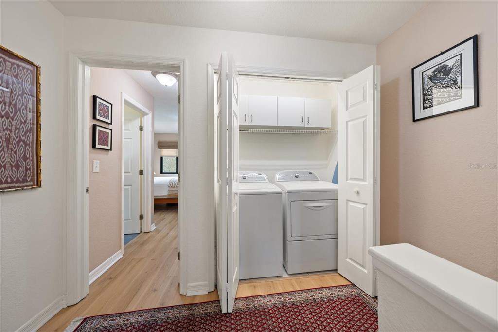 1206 Gulf Boulevard, Unit A6 Indian Rocks Beach, FL 33785 - Photo 27 of 61 a bathroom with a toilet a sink and a mirror