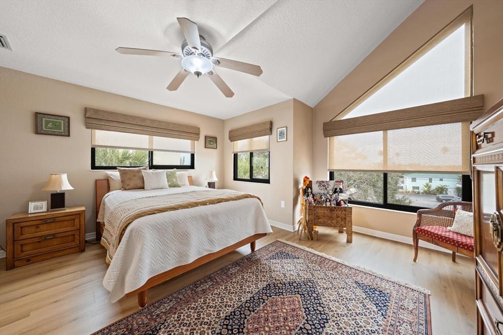1206 Gulf Boulevard, Unit A6 Indian Rocks Beach, FL 33785 - Photo 29 of 61 a bedroom with a large bed and a large window