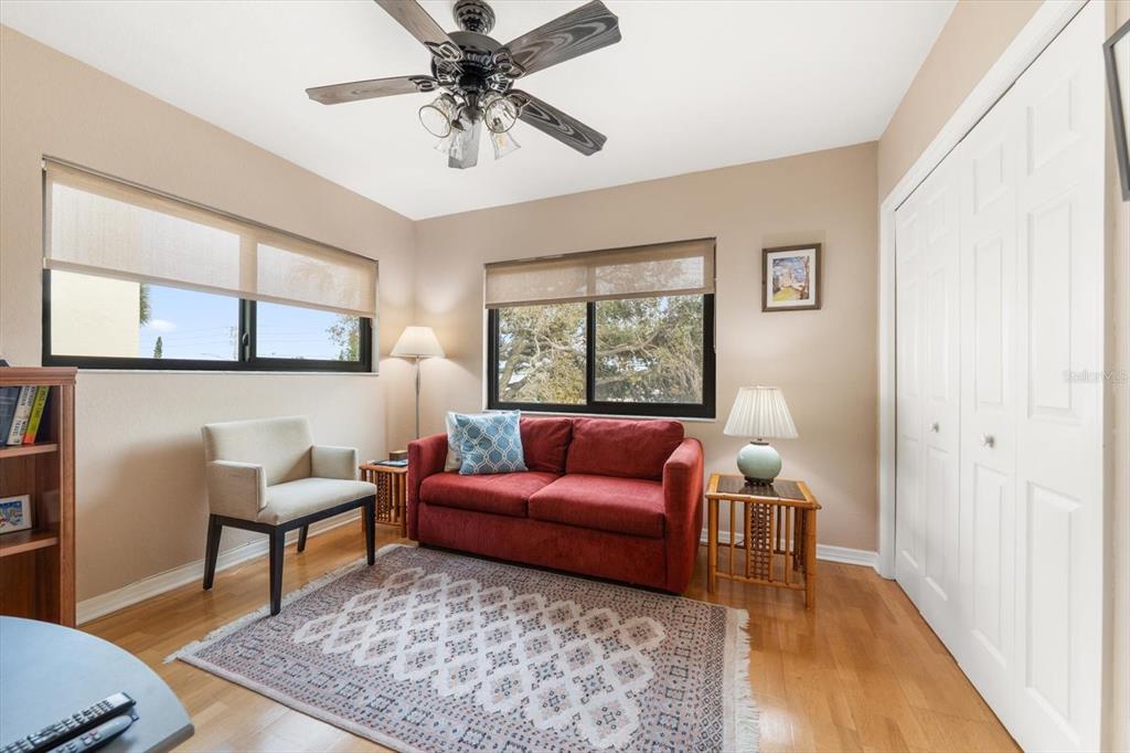 1206 Gulf Boulevard, Unit A6 Indian Rocks Beach, FL 33785 - Photo 32 of 61 a living room with furniture and a rug