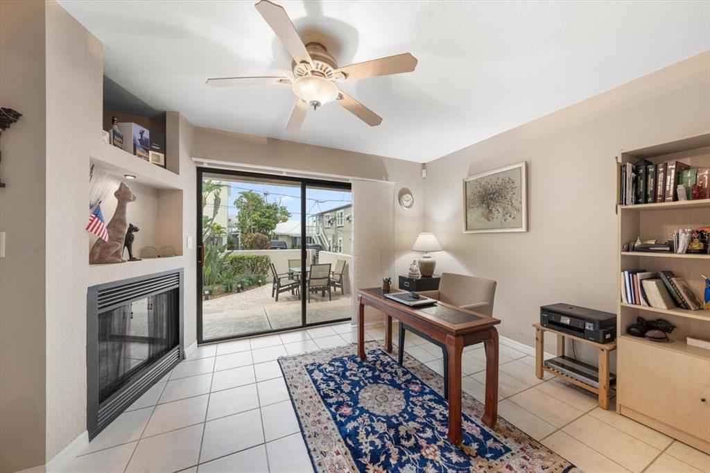 1206 Gulf Boulevard, Unit A6 Indian Rocks Beach, FL 33785 - Photo 35 of 61 a living room with furniture and a floor to ceiling window