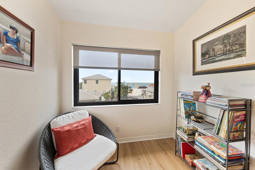 1206 Gulf Boulevard, Unit A6 Indian Rocks Beach, FL 33785 - Photo 41 of 61 a living room with furniture and a window