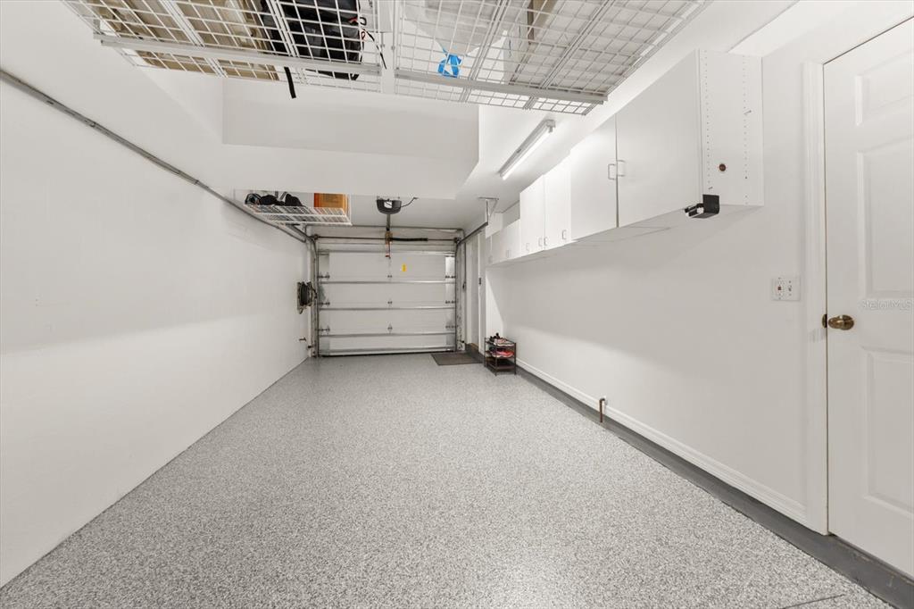 1206 Gulf Boulevard, Unit A6 Indian Rocks Beach, FL 33785 - Photo 44 of 61 a view of a room with stairs and white walls